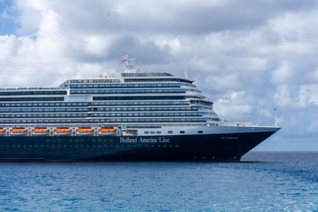 A side view of Holland America cruise line sailing at the sea