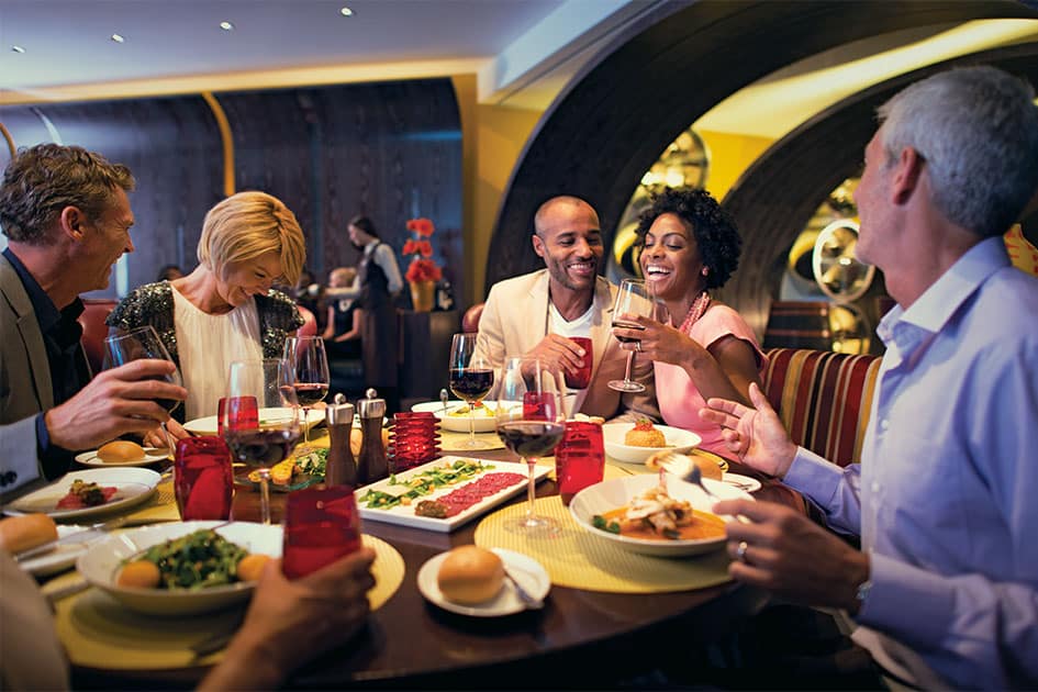 People enjoying lavish dining at a cruise ship