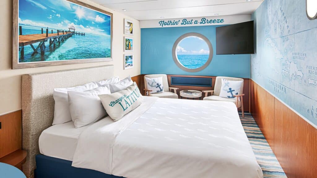 oceanview staterooms on a cruise luxury bed and painting on wall