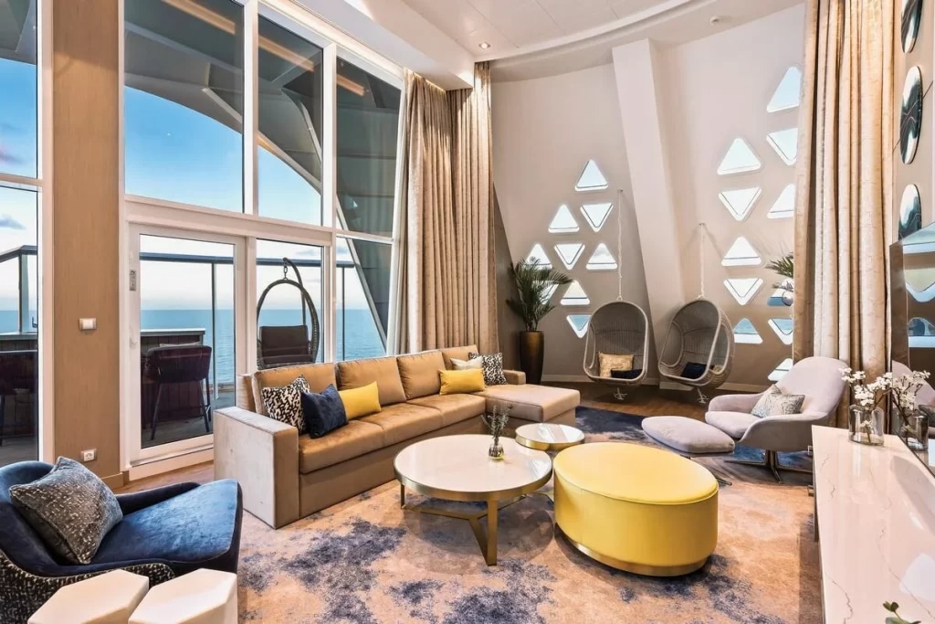 royal suite on a cruise ship sofas placed in living room with ocean views