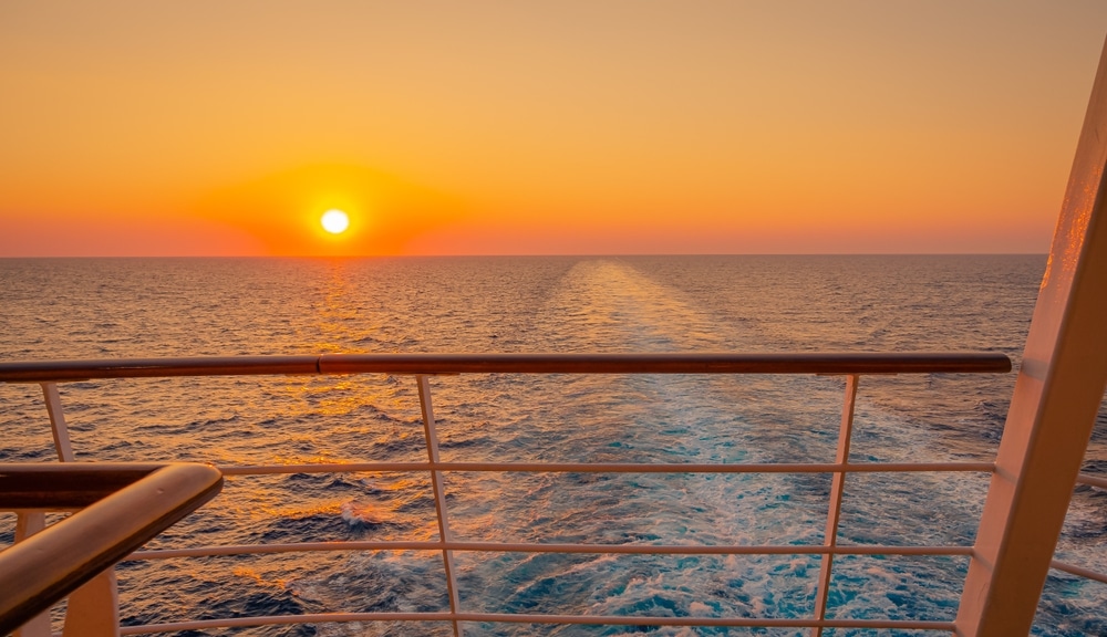 Promenade Deck Of A Cruise Ship In Navigation With Sunset